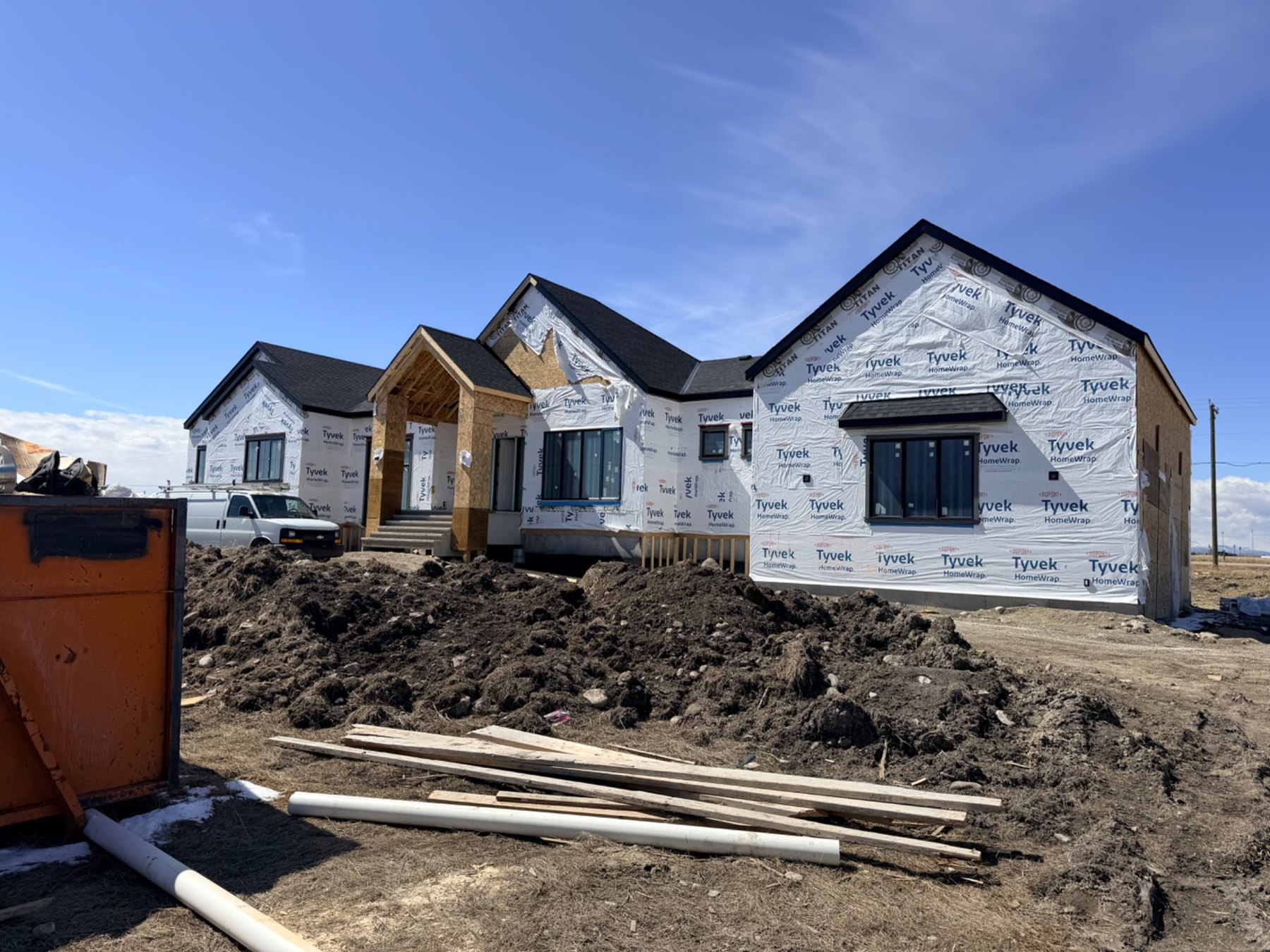 House with exterior wrapping before siding installation